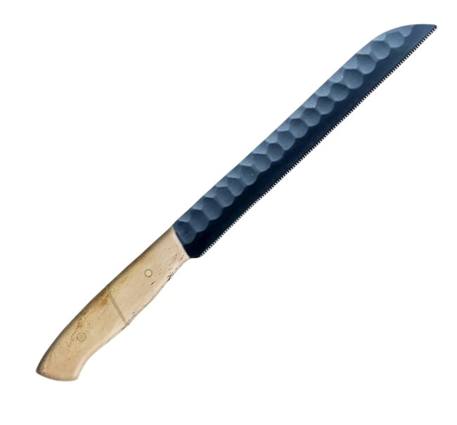 12.1-inch serrated knife with a carbon coated steel blade, featuring a wavy-edge design for slicing bread and pastries, paired with an ergonomic beige camel bone handle